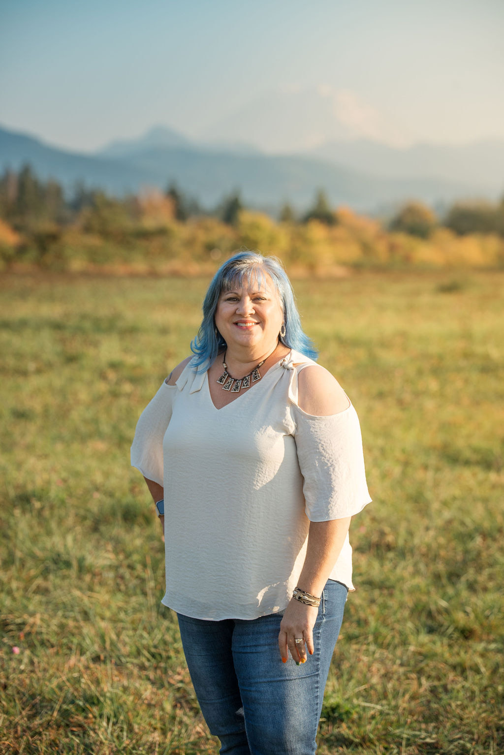 Eva standing in front of the mountains